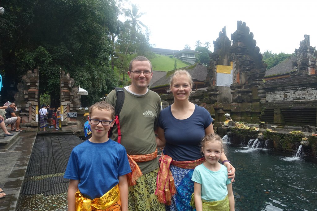 In sashes and sarongs at water temple