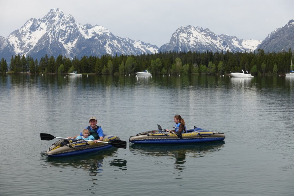 father and daughters kayaking