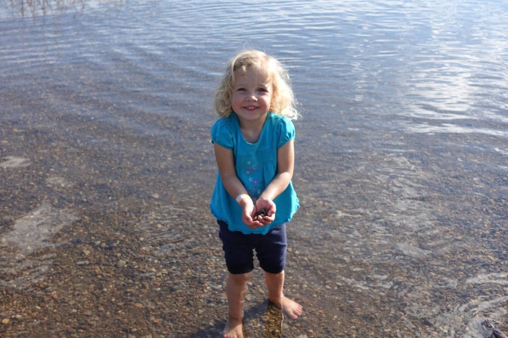 girl collecting rocks