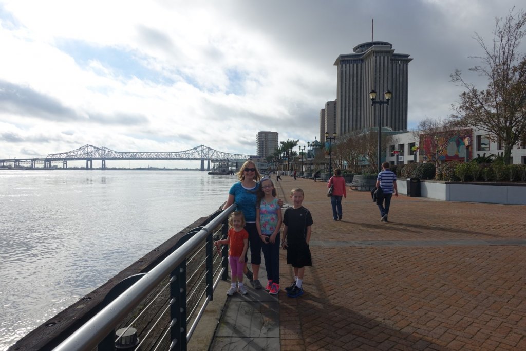 family with bridge in the background