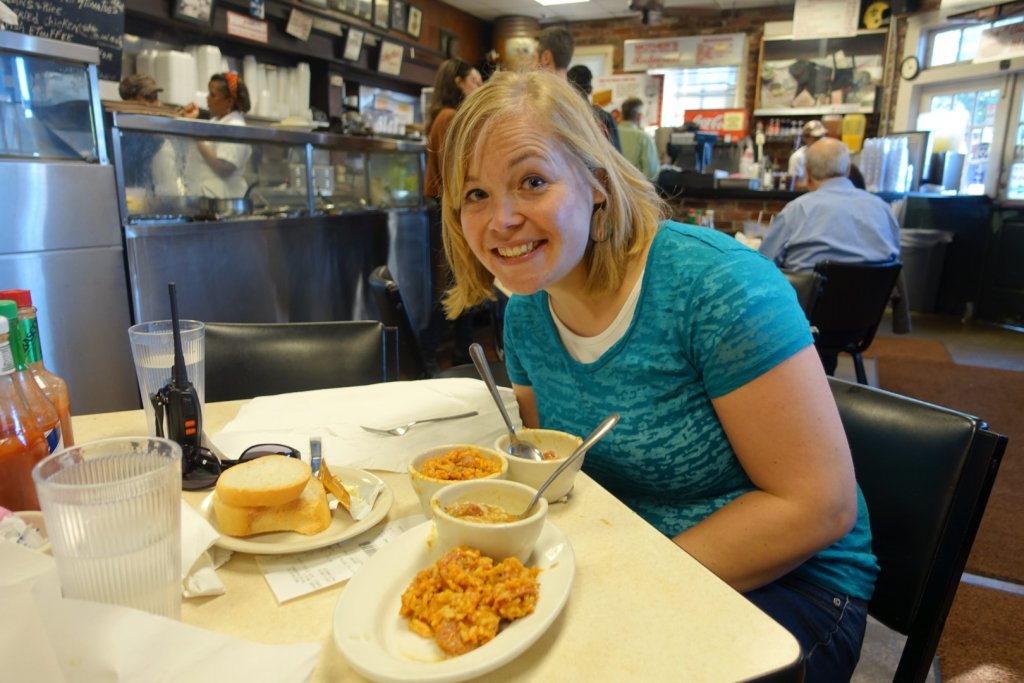 woman eating jambalaya and gumbo