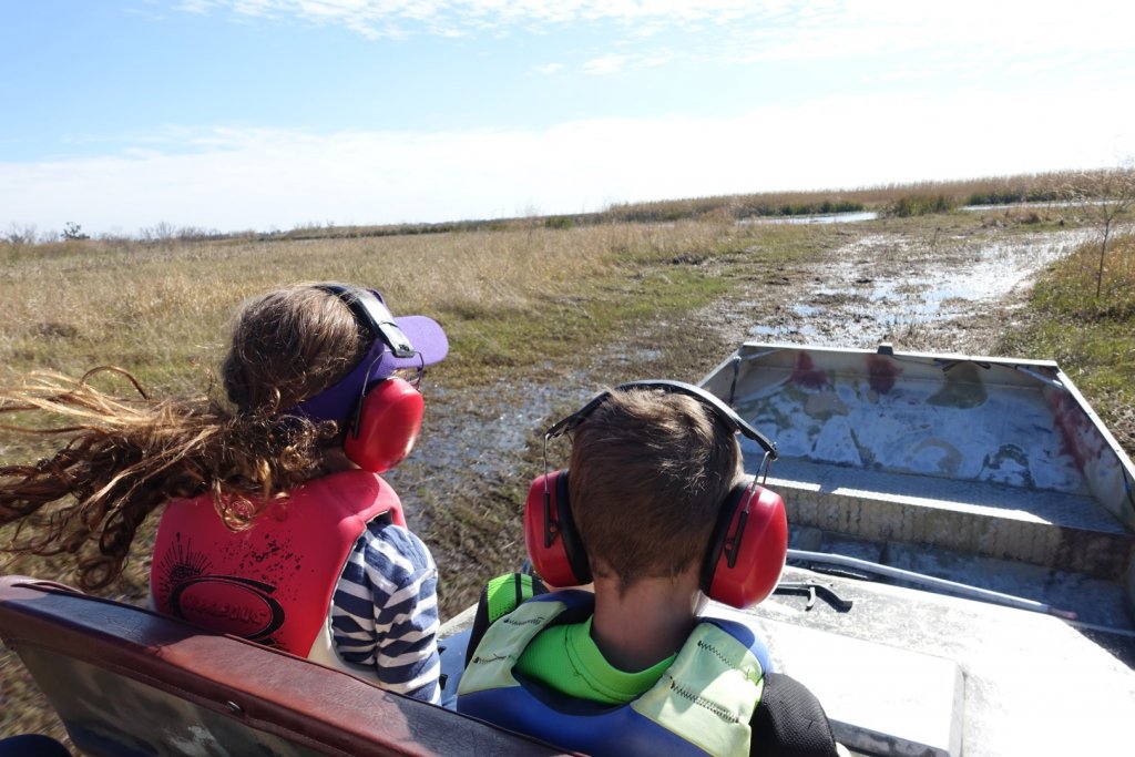 kids riding in an airboat