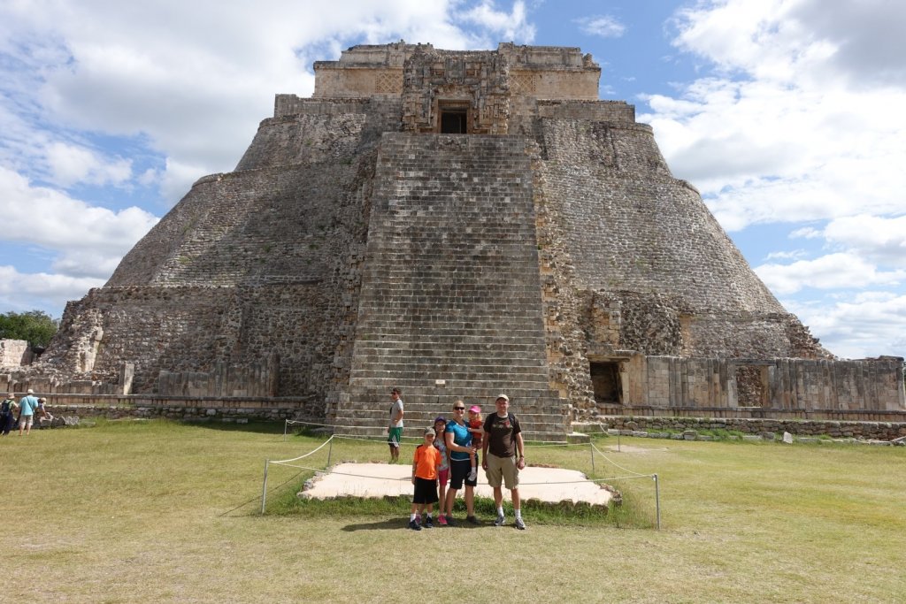 family in front of a Mayan temple