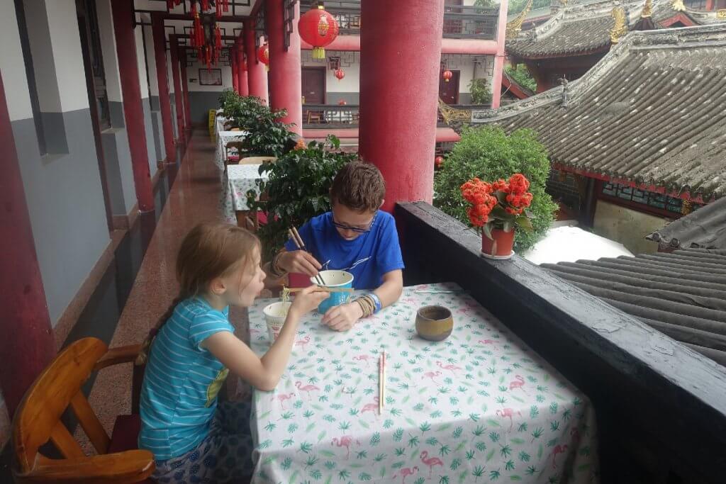 Eating noodles with chopsticks and the Wenshun Mansion Hotel