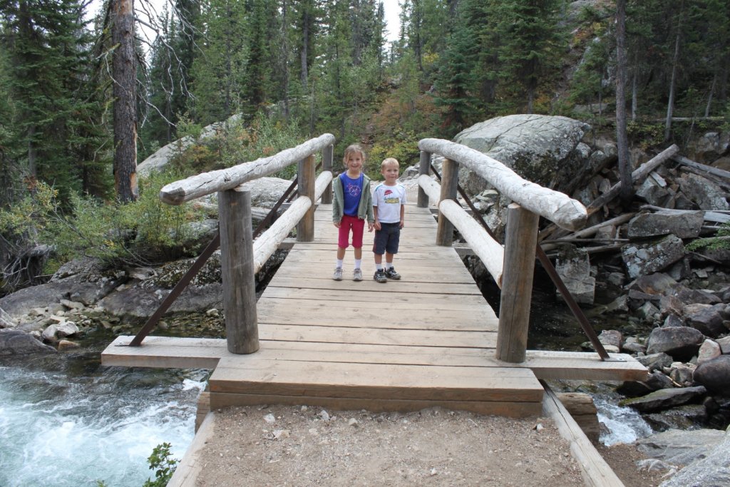 two kids on a bridge