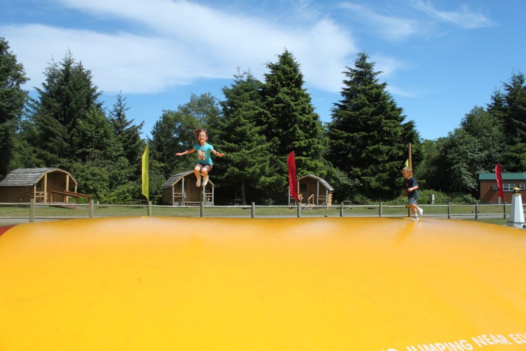 jumping on the jumping pillow at the Astoria KOA Campground