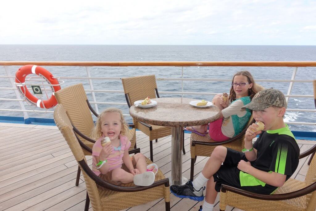 kids eating ice cream on the deck of a cruise ship