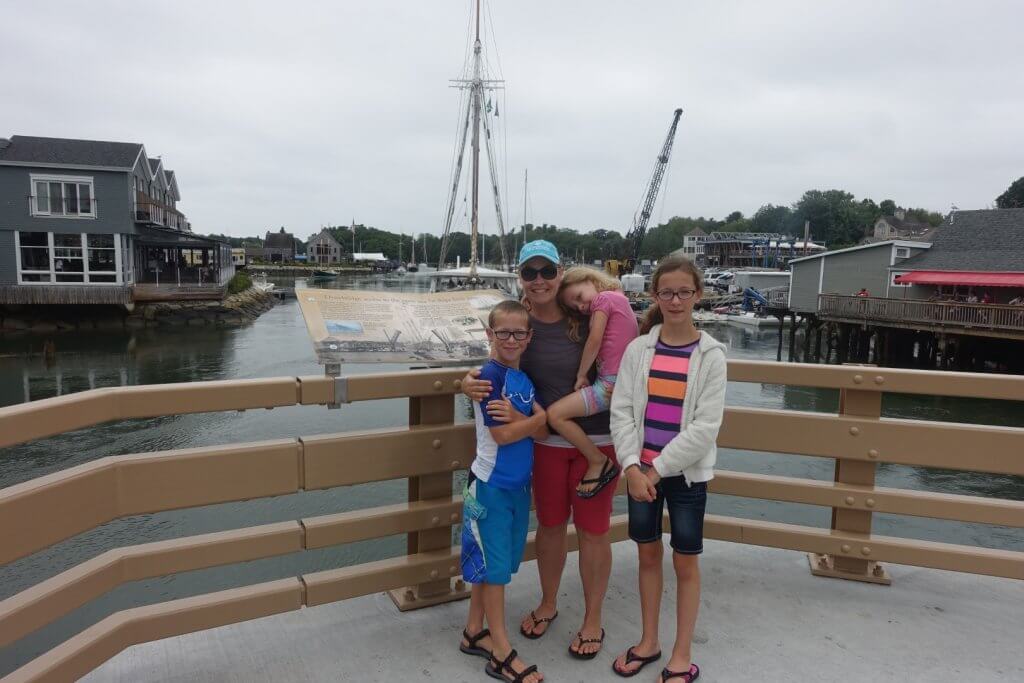 family in front of a beach town