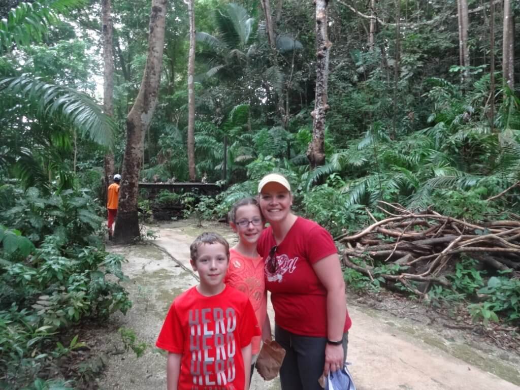 Mom and kids with monkeys in the background