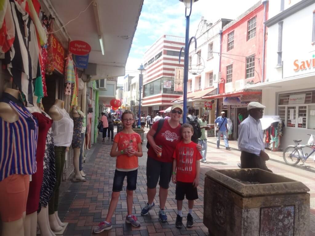 mom and kids on a street in Barbados