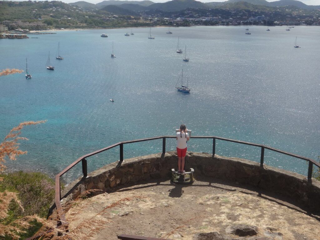 girl looking at the harbor with ships