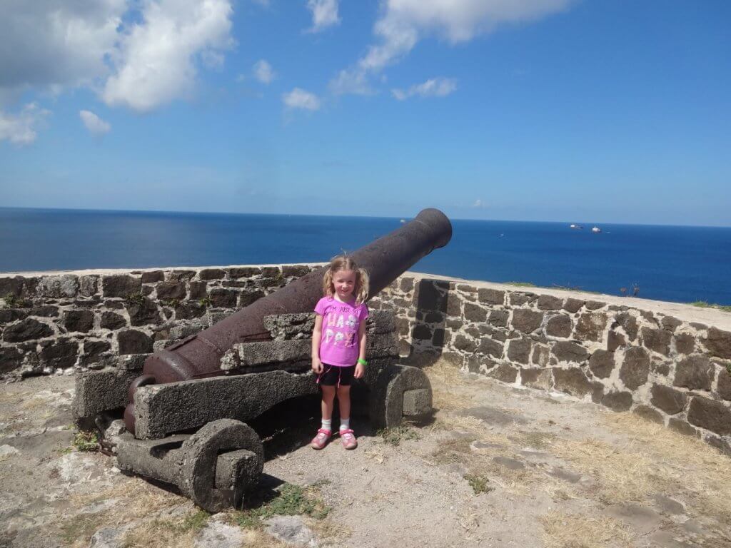 girl by an old cannon