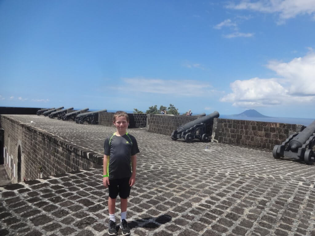 Boy at fort with cannons