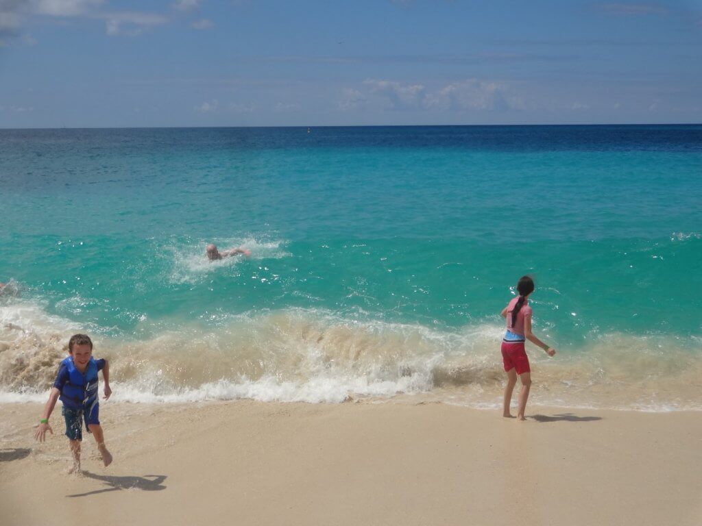 kids running on the beach