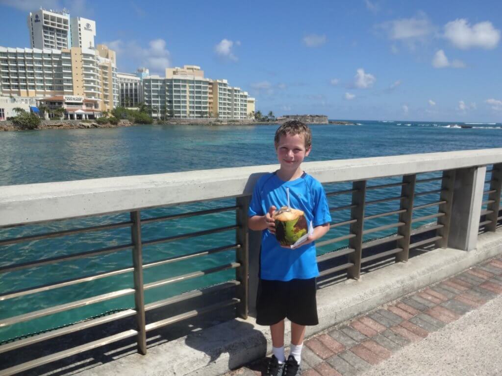 boy drinking from a coconut