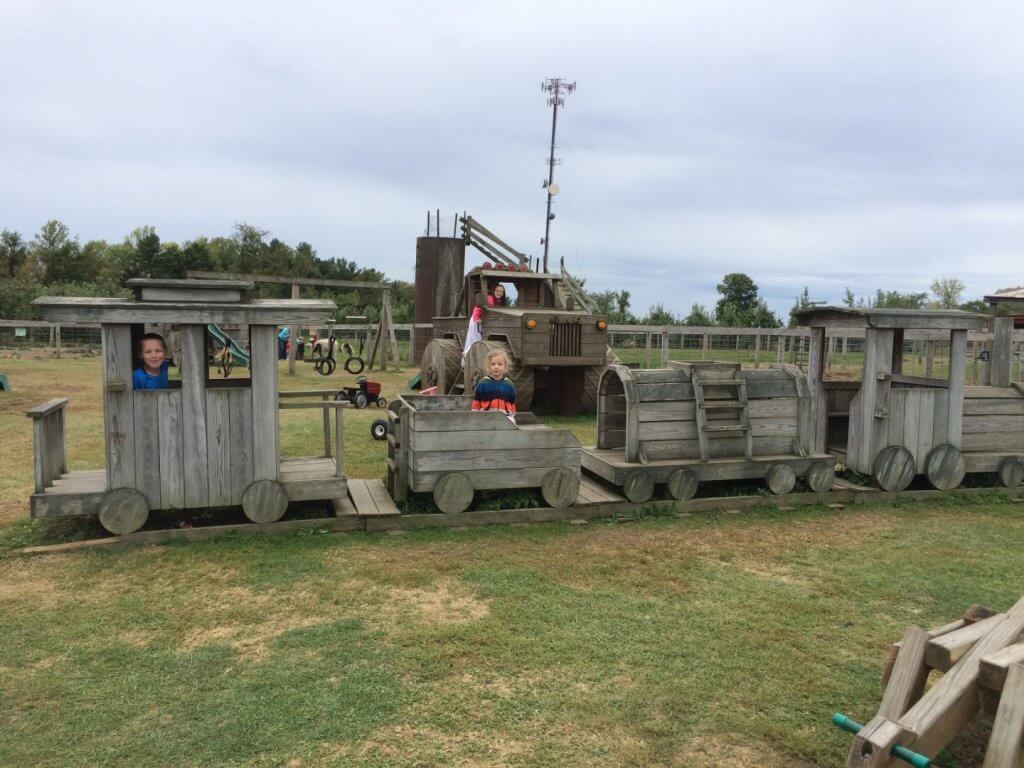 kids on a wooden train