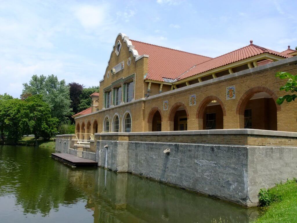 brick building on a lake