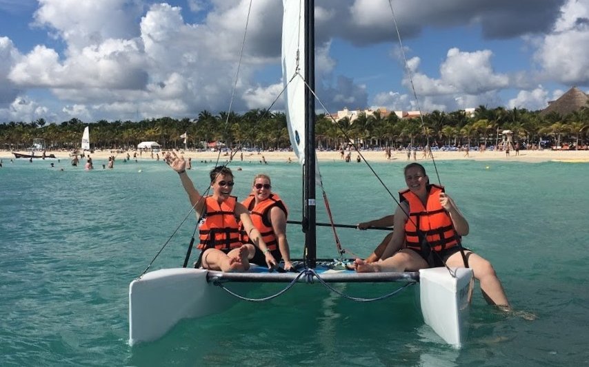women on a catamaran