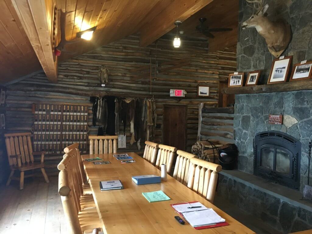 table and fireplace in cabin