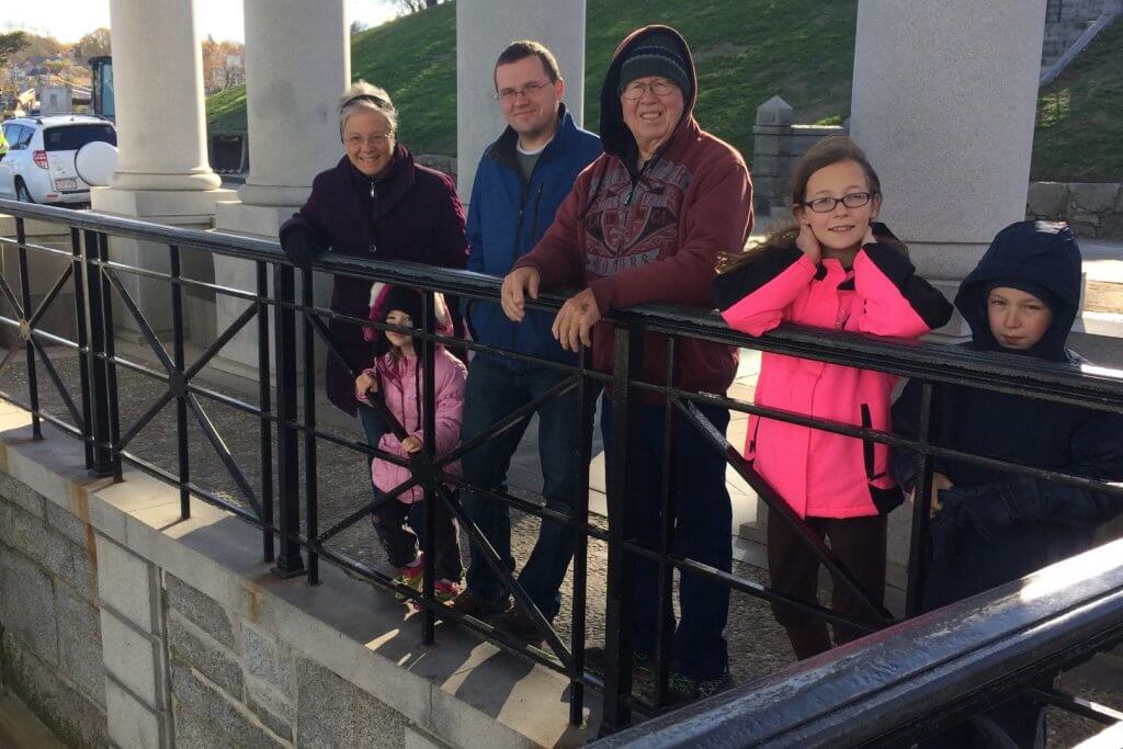 family by a fence