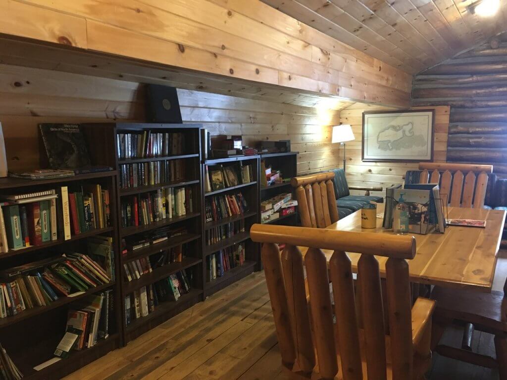 bookshelves with table in cabin