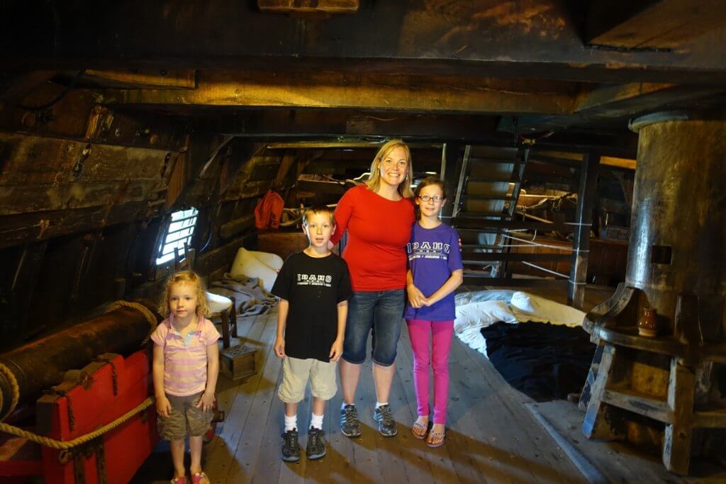 family on the lower deck of a ship