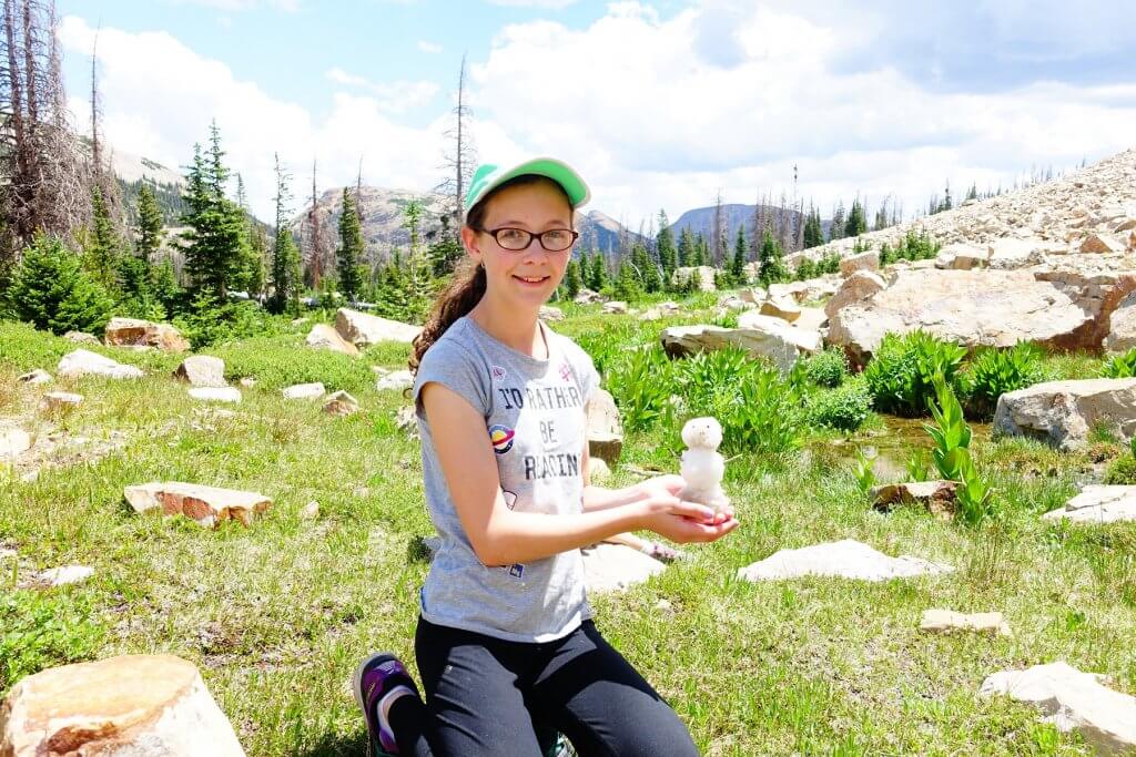 girl with a mini snowmand