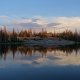 lake at sunset with pine trees