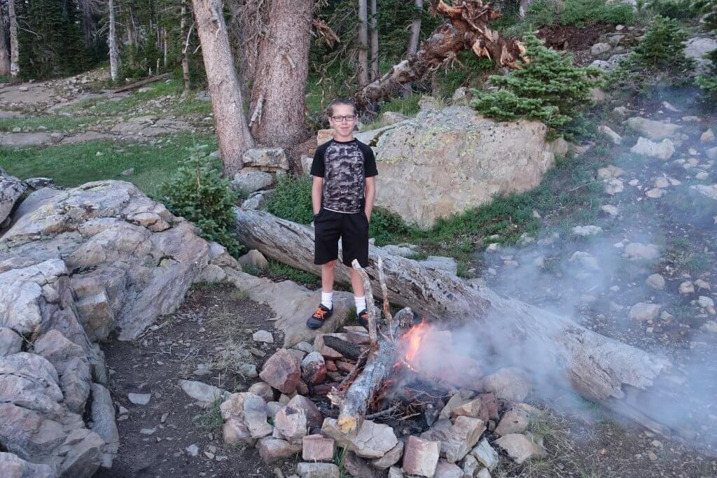 boy with campfire