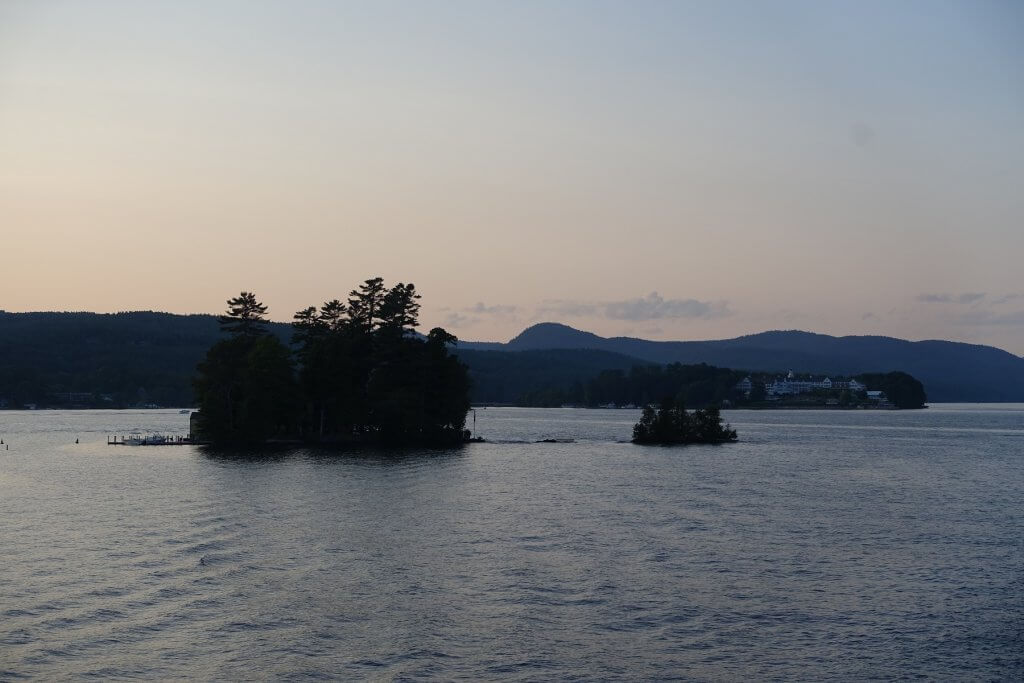 tiny island in lake at sunset