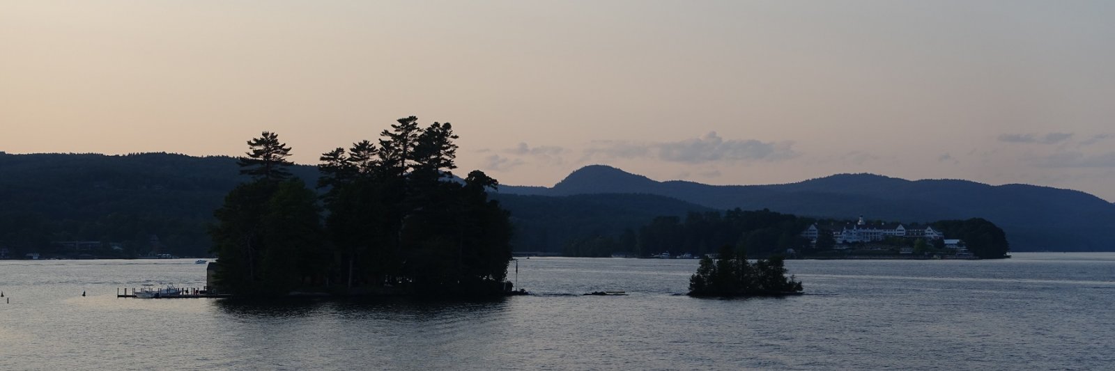 tiny island in lake at sunset