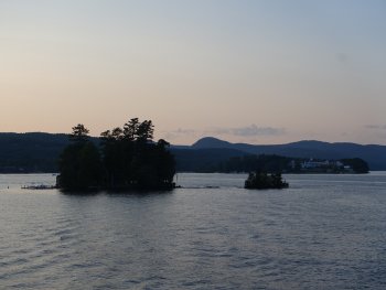 tiny island in lake at sunset