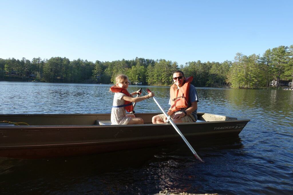 girl and dad in a paddle boat