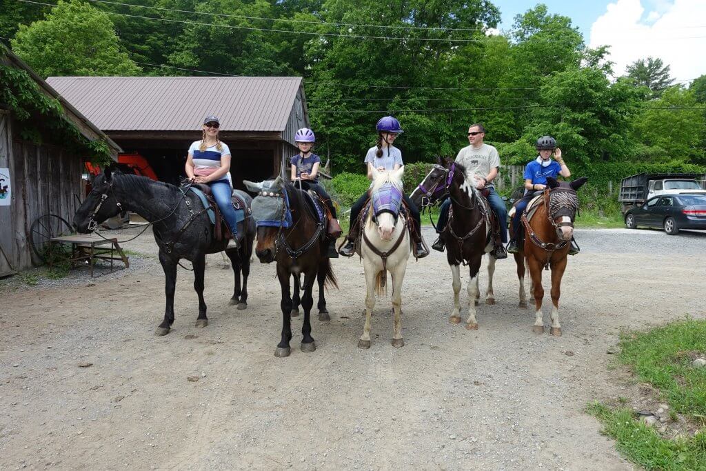 family on horses