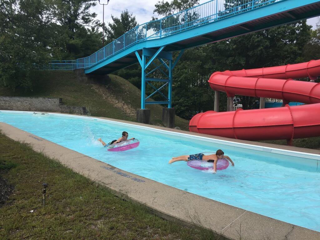 two boys on tubes in lazy river