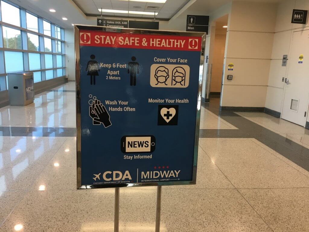 health guidelines sign in airport