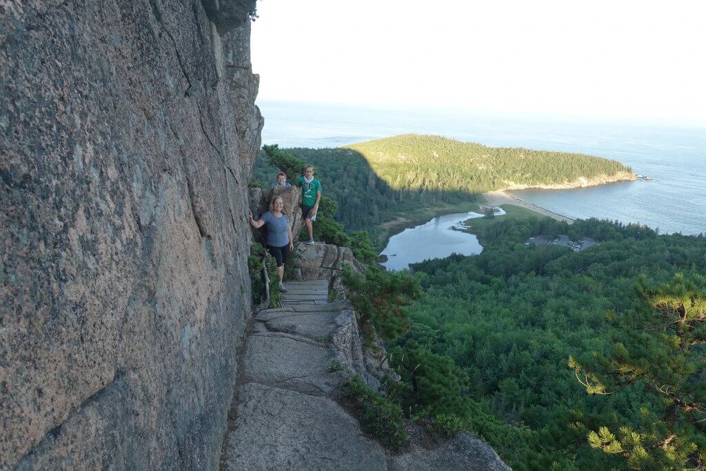 woman and boys on mountain trail