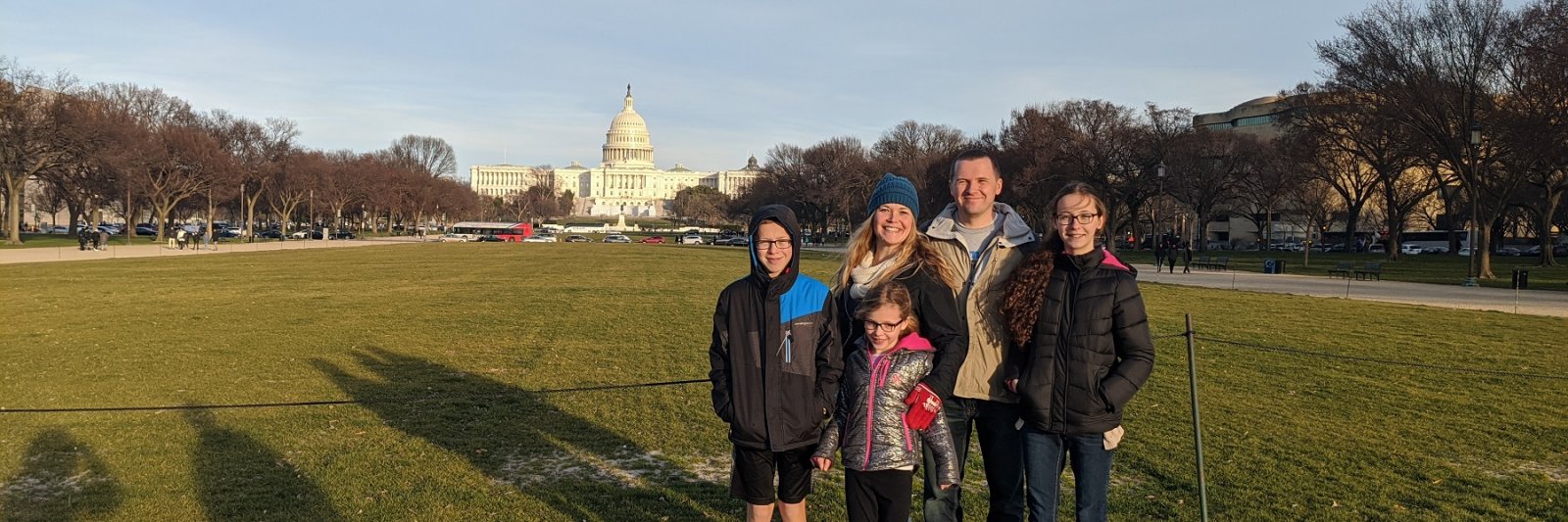 family in front of building