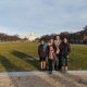 family in front of building