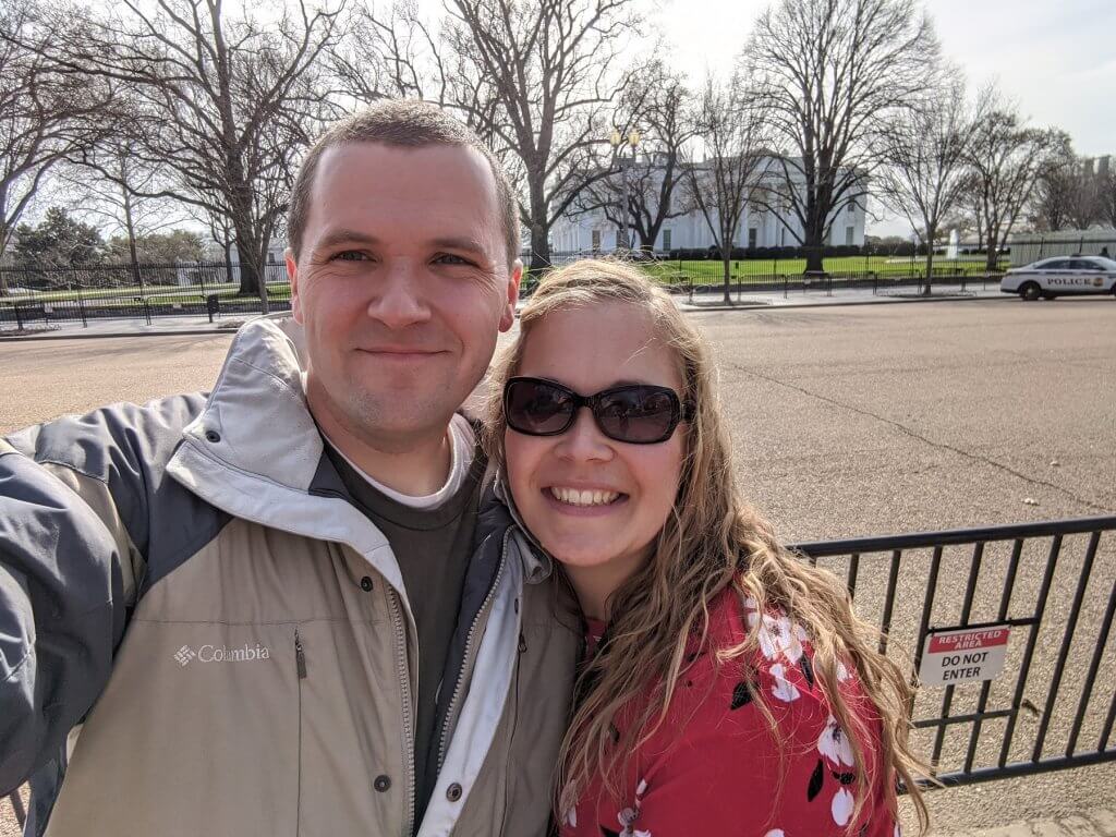 man and woman in front of building