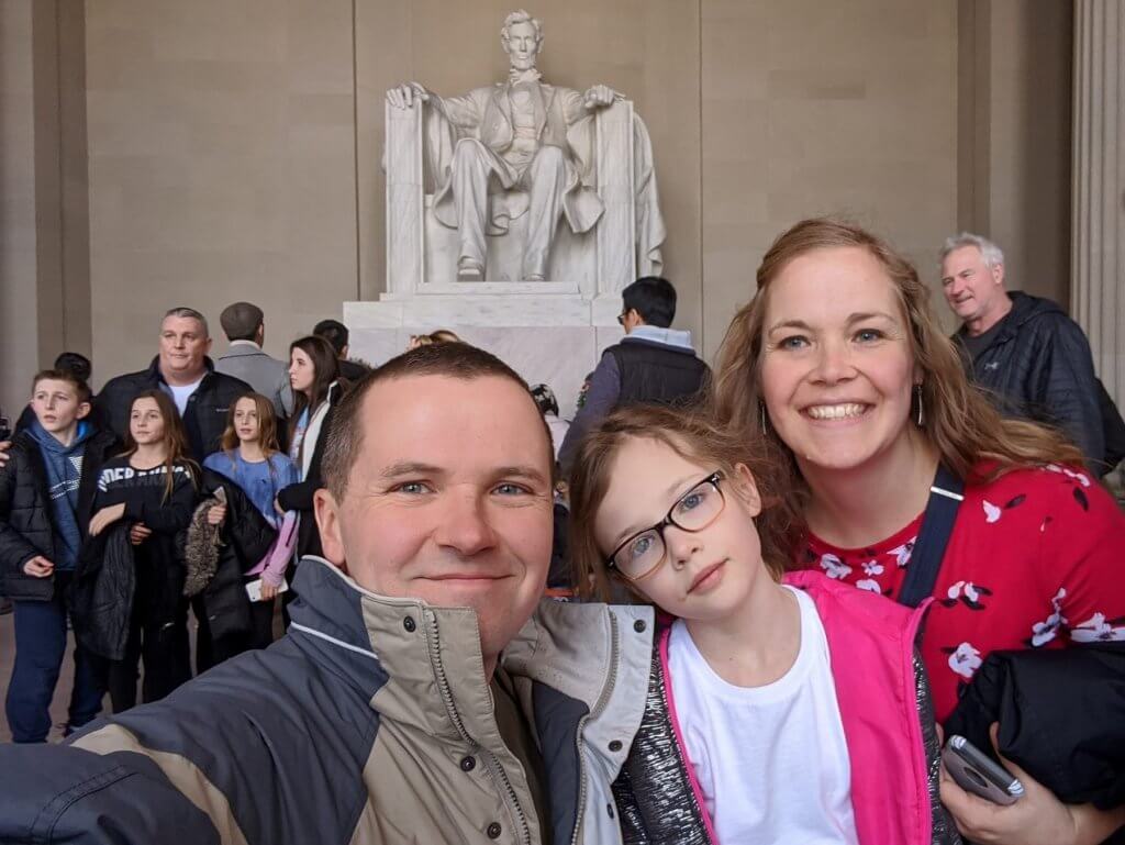 people in front of Abraham Lincoln statue