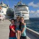 three kids in front of cruise ships