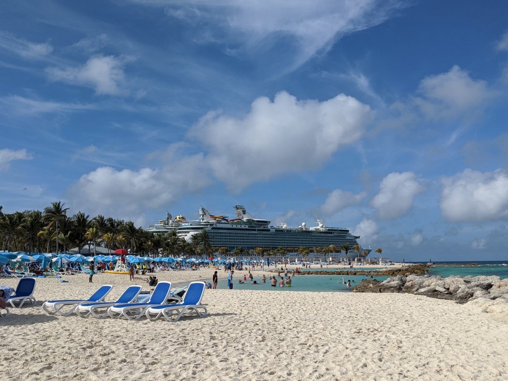 beach with cruise ships in the background