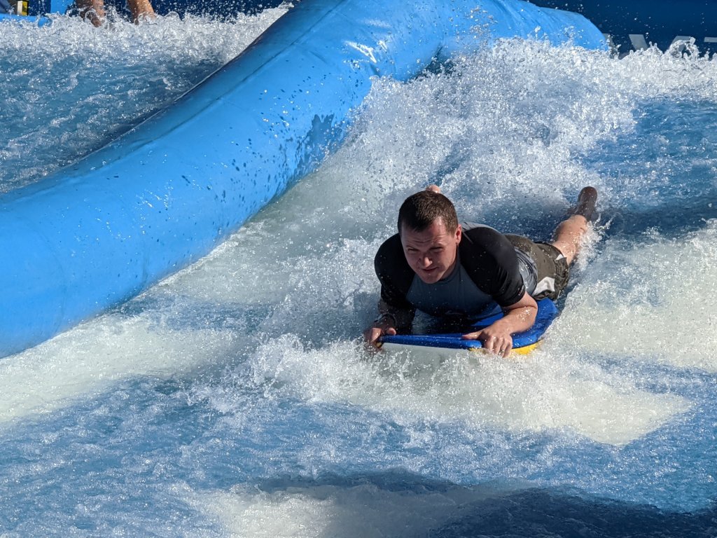 man boogie boarding on flowrider