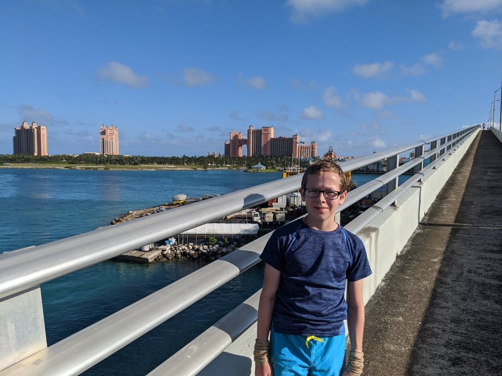 Boy on bridge in front of Atlantis Resort