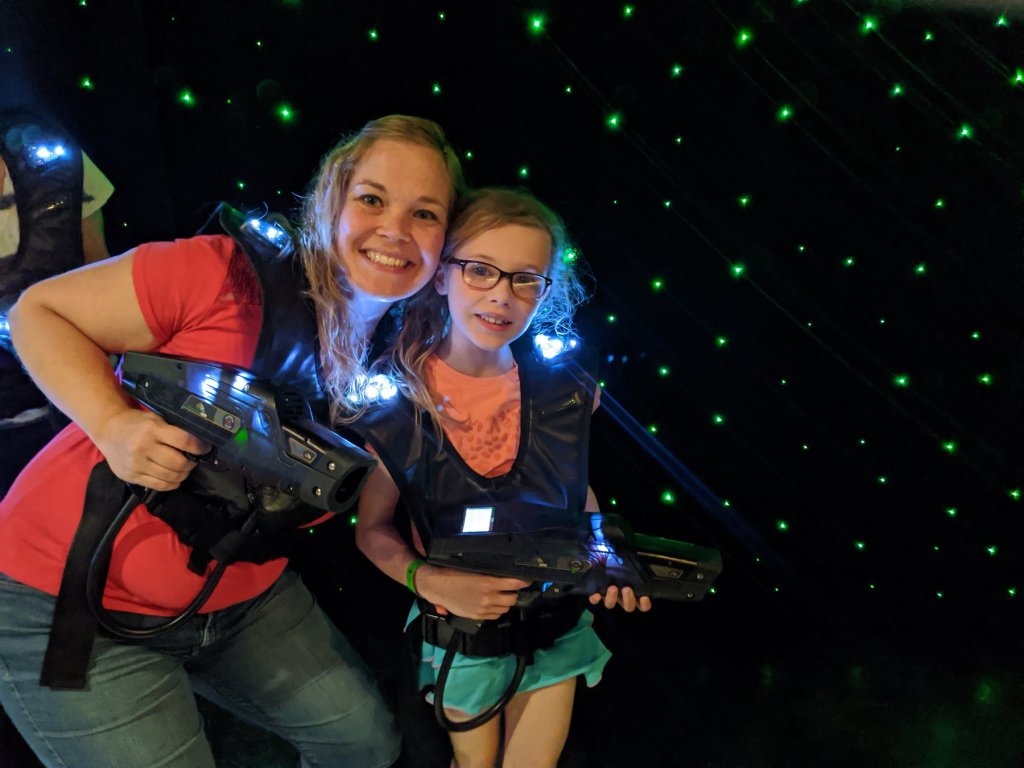 Two people with laser tag gear