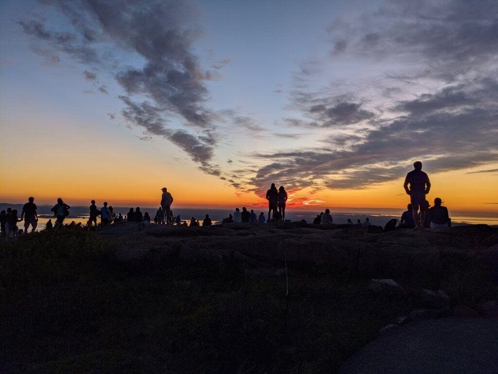 silhouettes in front of sunrise