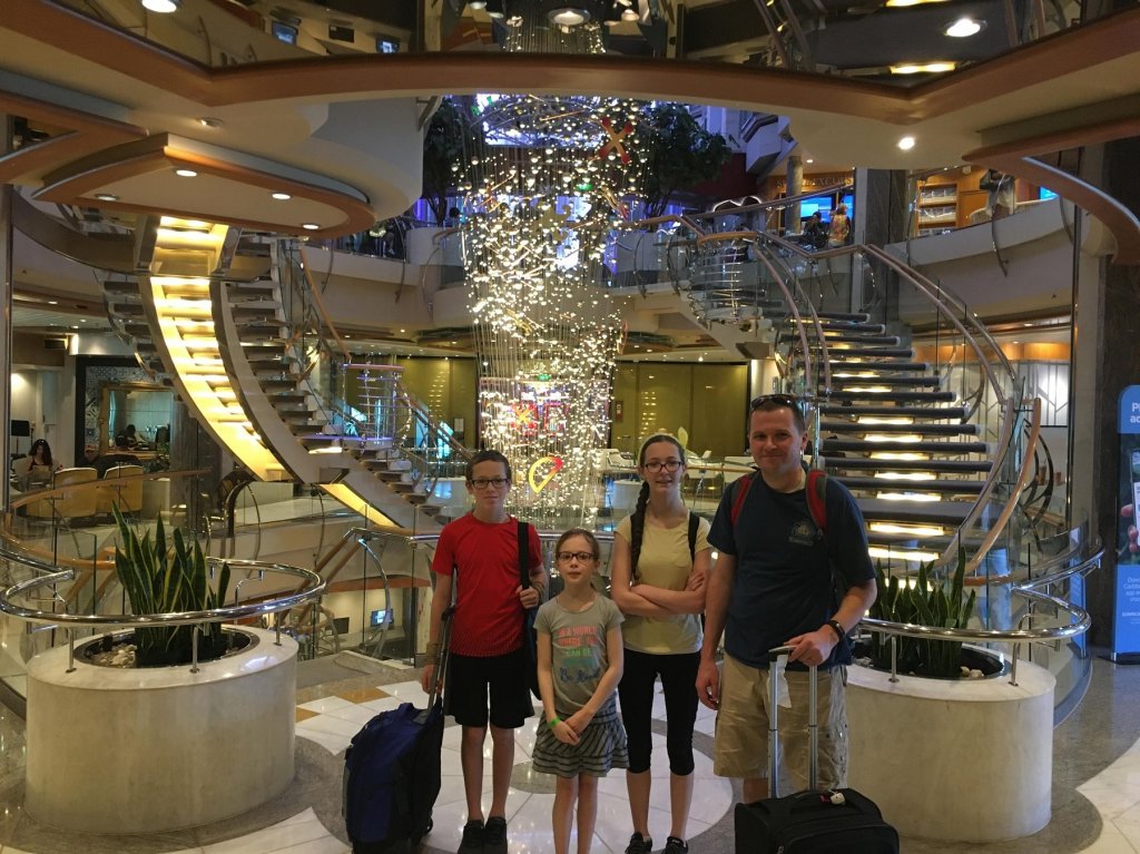 family in front of staircase