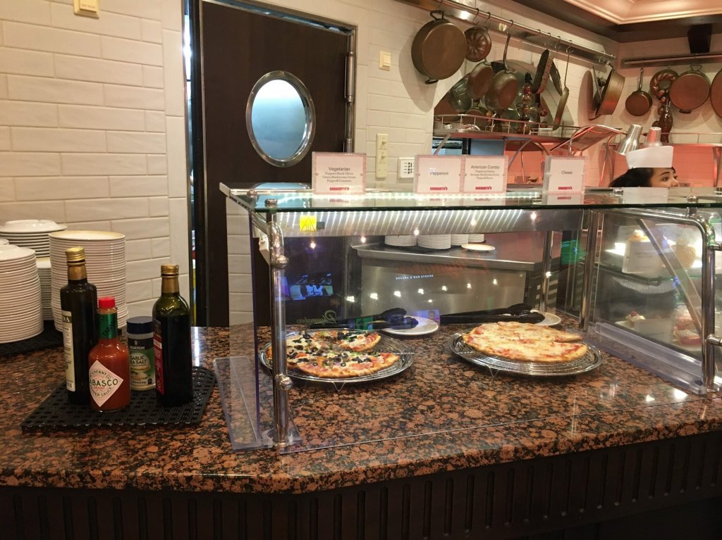 pizza behind counter