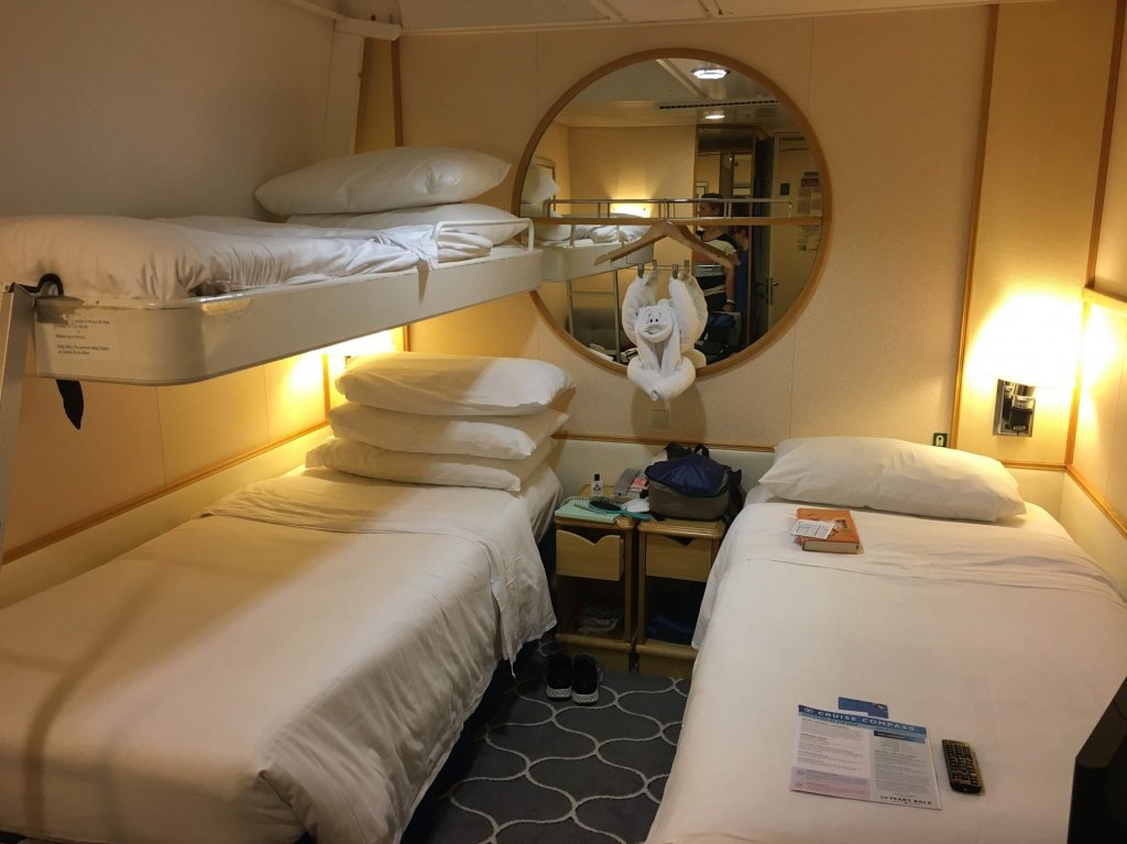 stateroom with three beds on cruise ship